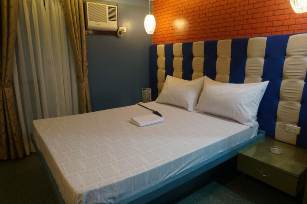 Icon Hotel Manila Habitación foto